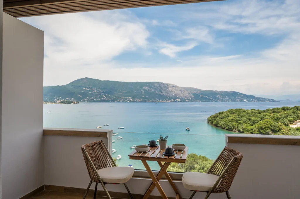 Balcony dining table with sea view at Apovrado Stay Corfu